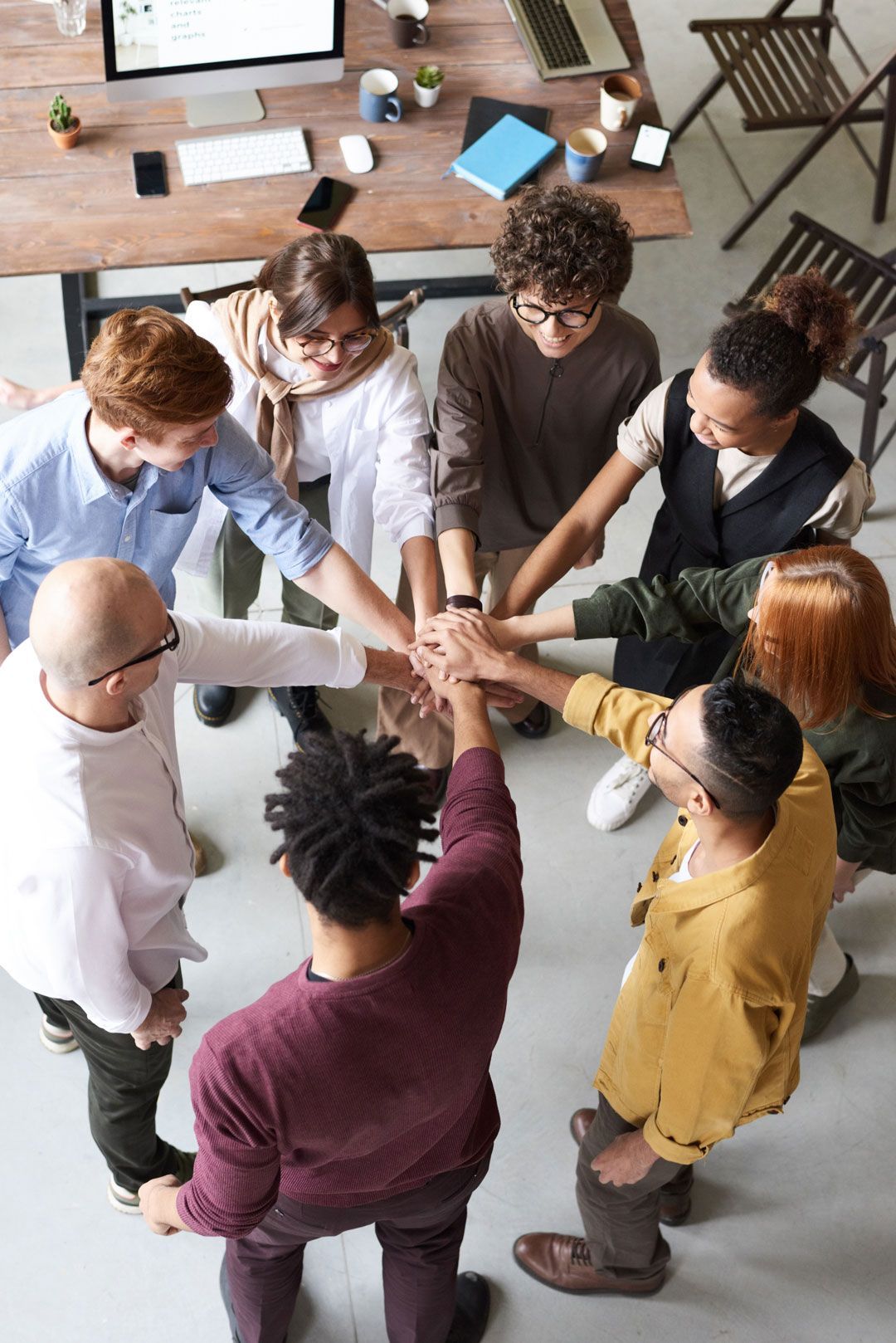 Photo of people holding each other s hands